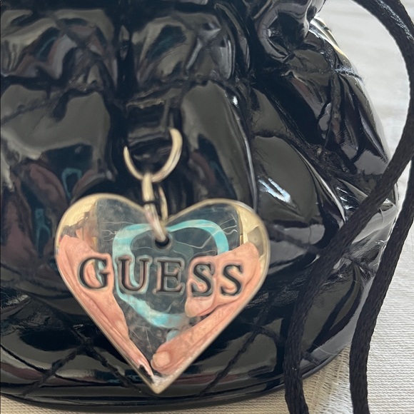 Guess Shiny Black Pouch with Silver Heart Charm - Picture 2 of 4